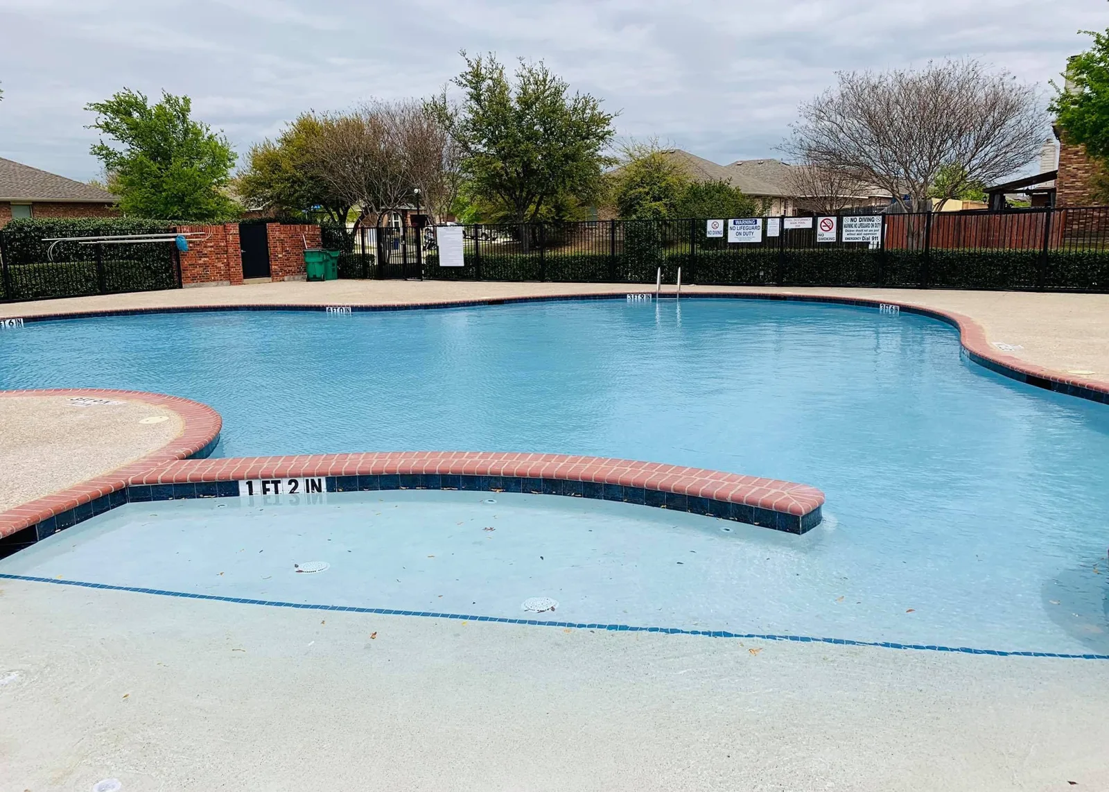 Neighborhood pool with worn waterline before and renewed finish after renovation