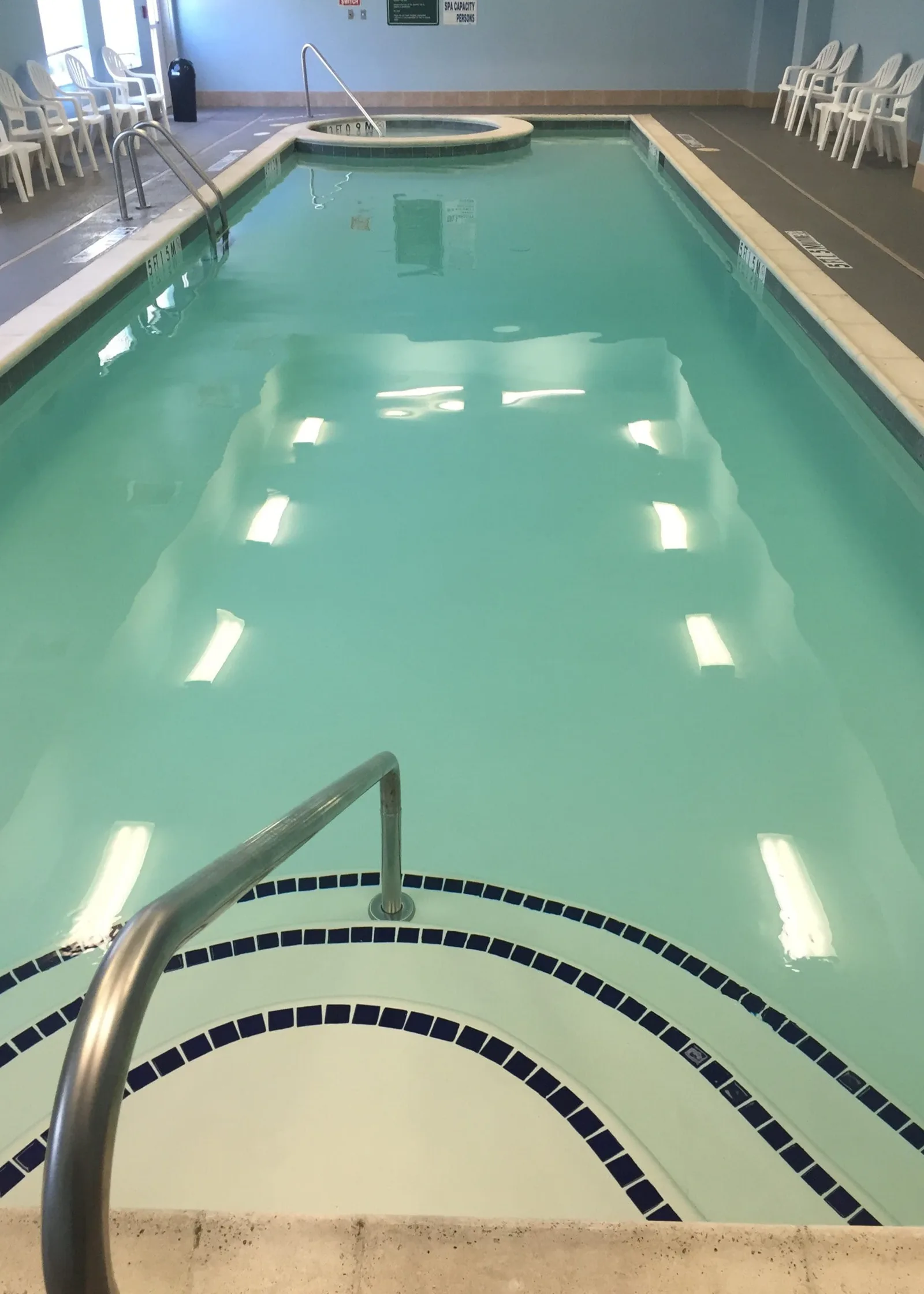 Amenity pool before and after resurfacing and tile work