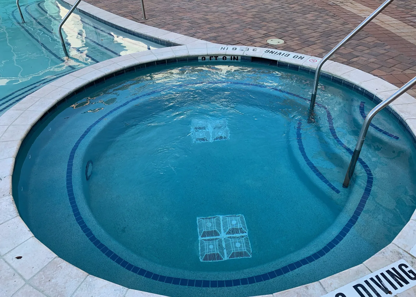 Apartment community pool before and after resurfacing